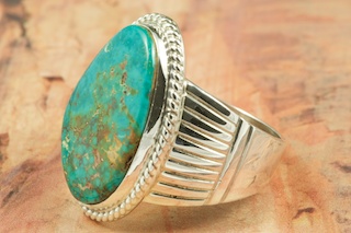 Genuine Manassa Turquoise set in Sterling Silver Ring. This Turquoise is also referred to as King�s Manassa Turquoise. The Manassa Turquoise mine is located in Manassa, Conejos County, Colorado. Created by Navajo Artist Phillip Sanchez. Signed. 
